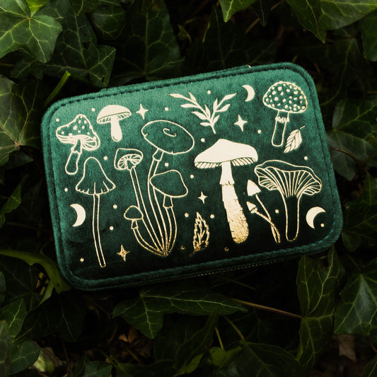 Green box with white mushroom illustrations on a leafy background