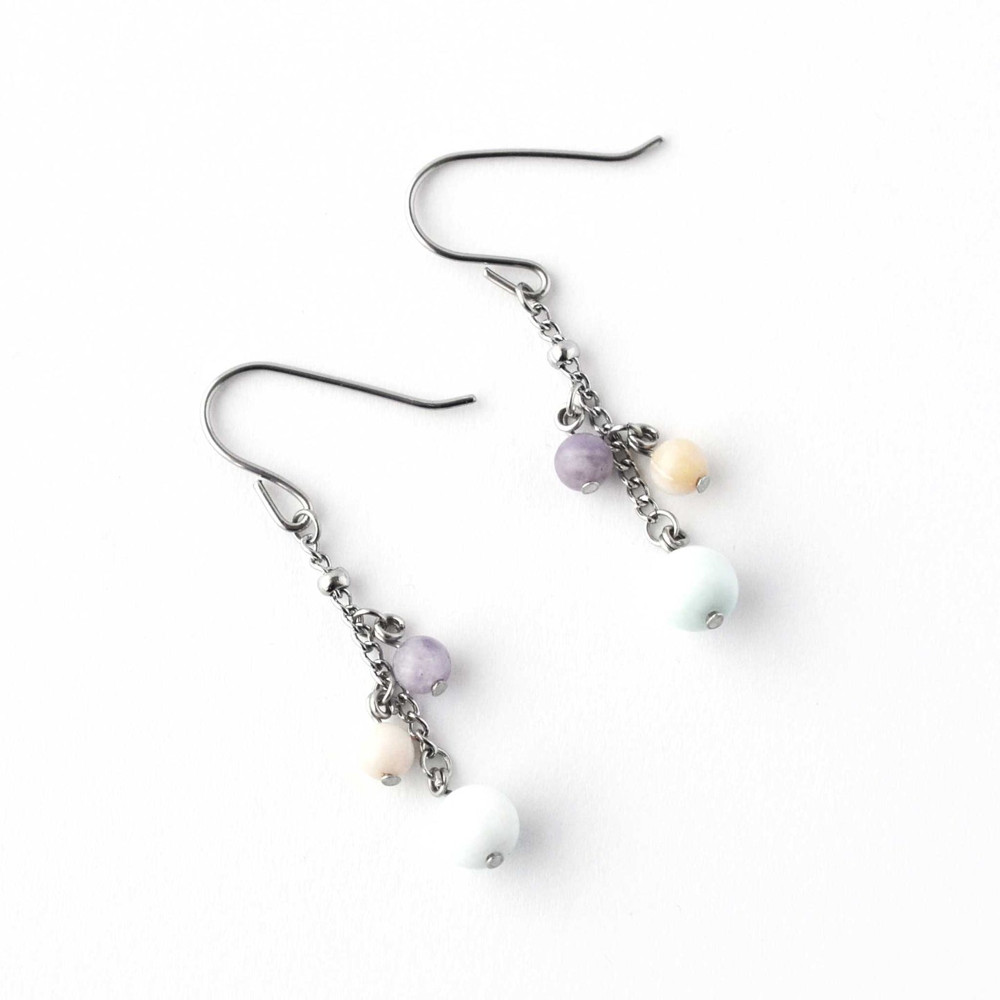 Flatlay Larimar, Pink Opal & Lepidolite gemstone bead drop earrings on white background
