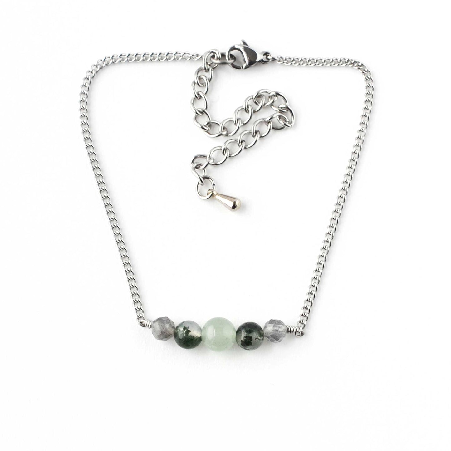 Green gemstone adjustable bracelet on white background