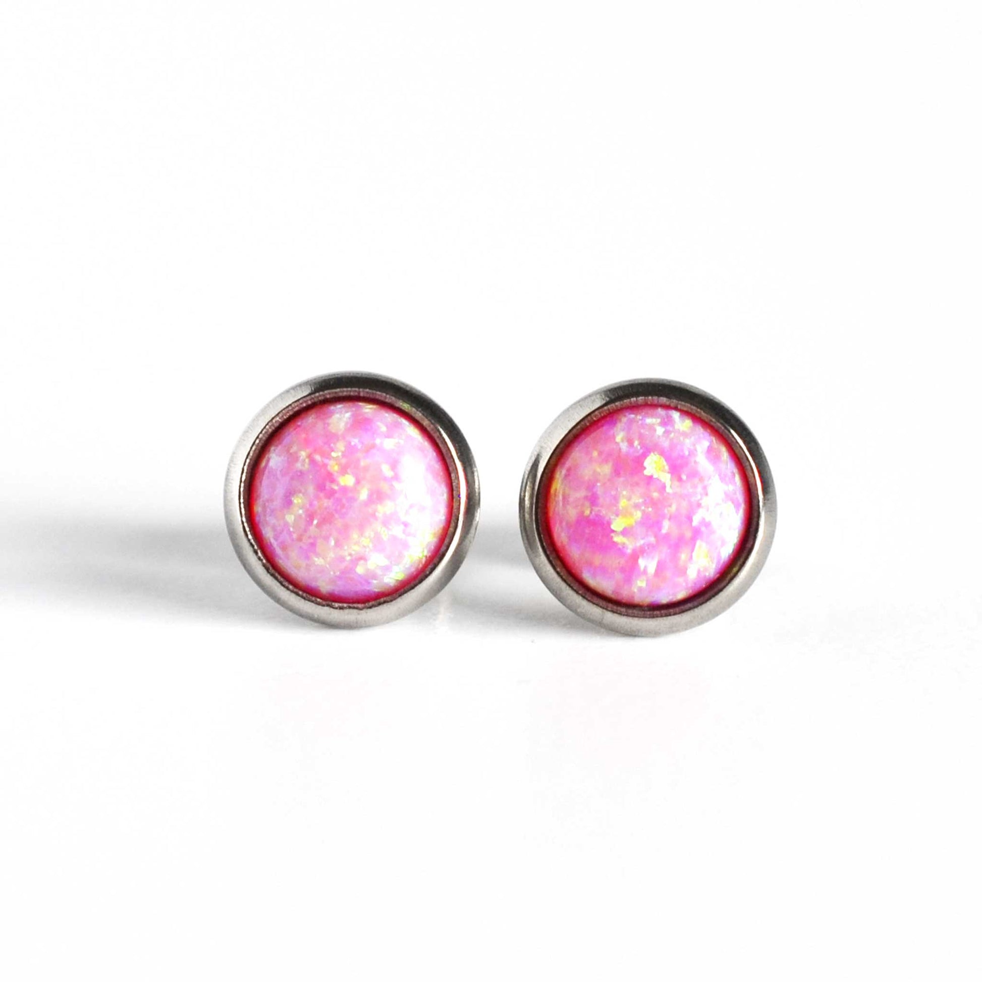 Front view of bright pink Opal stud earrings