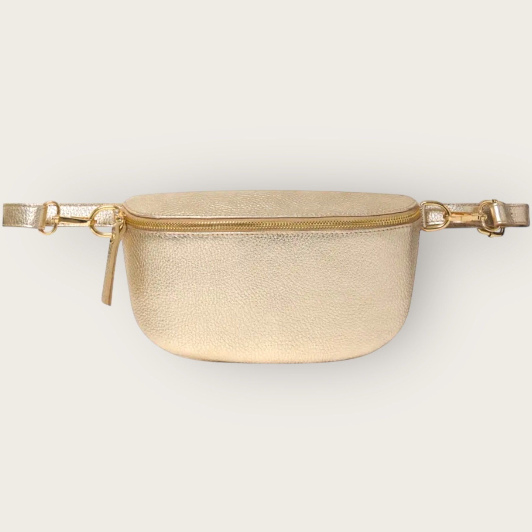 Gold waist bag on a light gray background