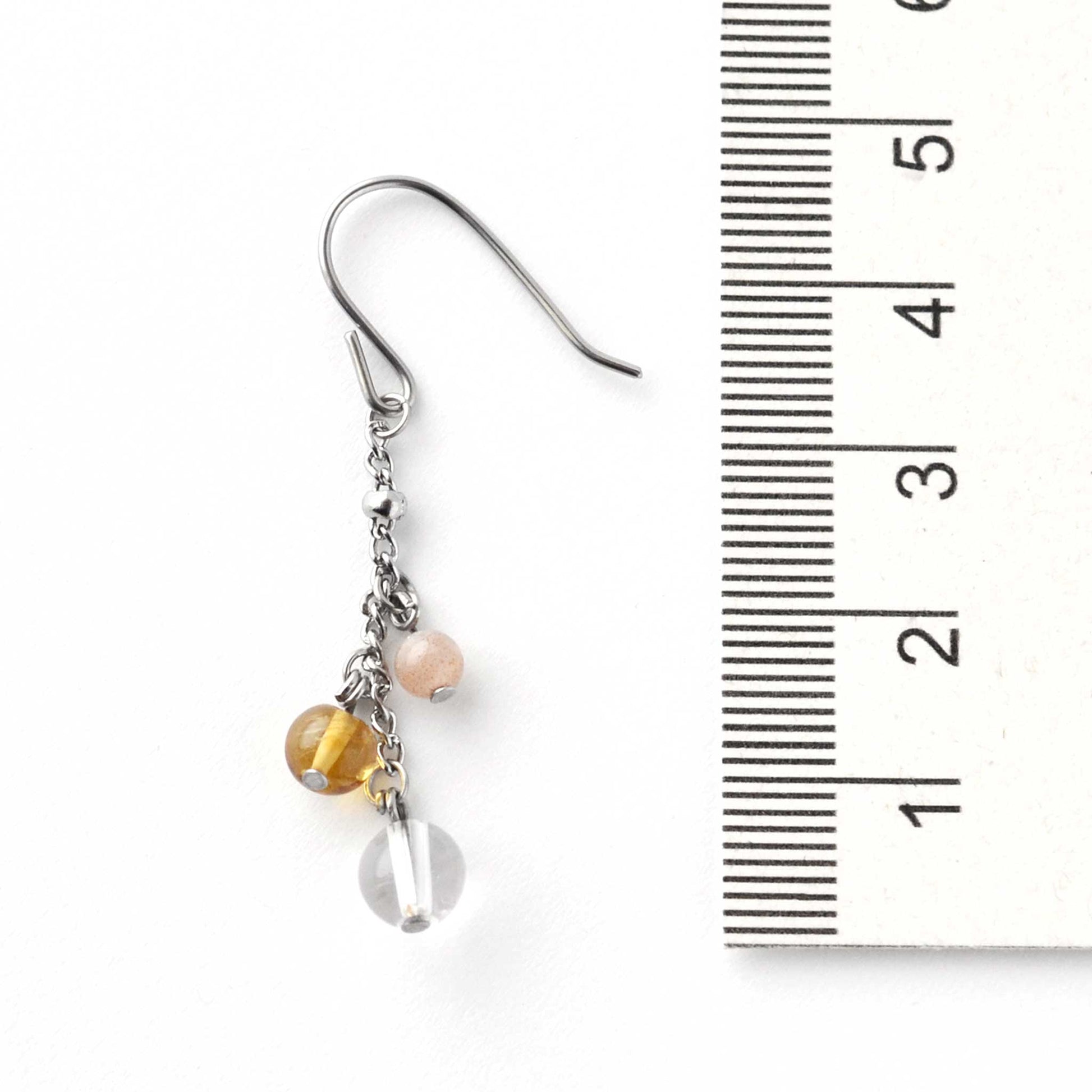 Yellow gemstone drop earring next to ruler showing drop length at 4.5cm