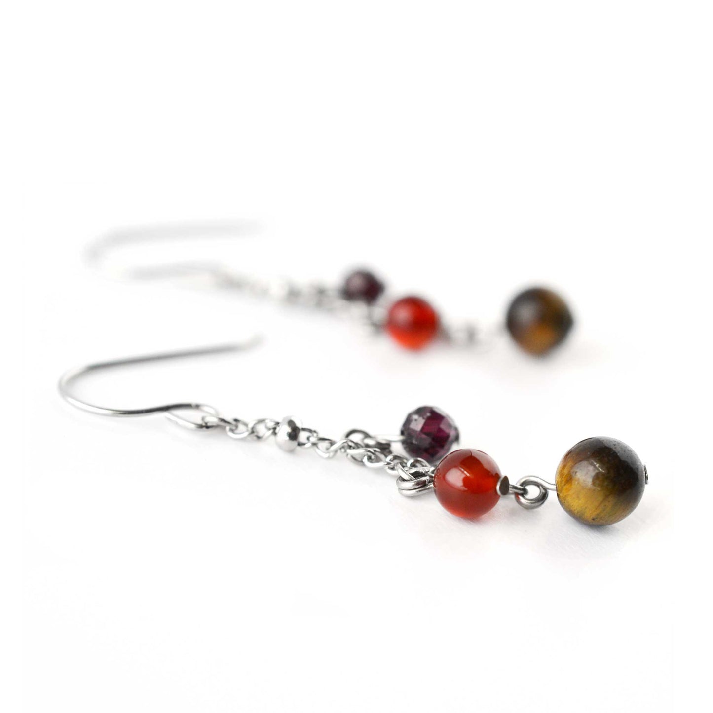 Close up of Tigers Eye, Carnelian & Garnet round bead gemstone drop earrings