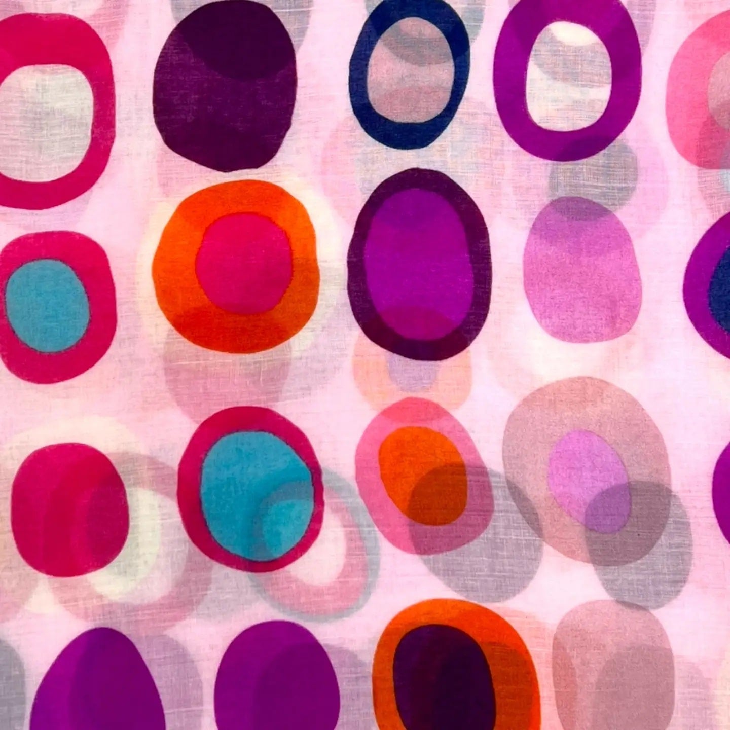 Pattern of colorful circles on a pink background