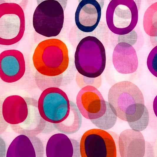 Pattern of colorful circles on a pink background