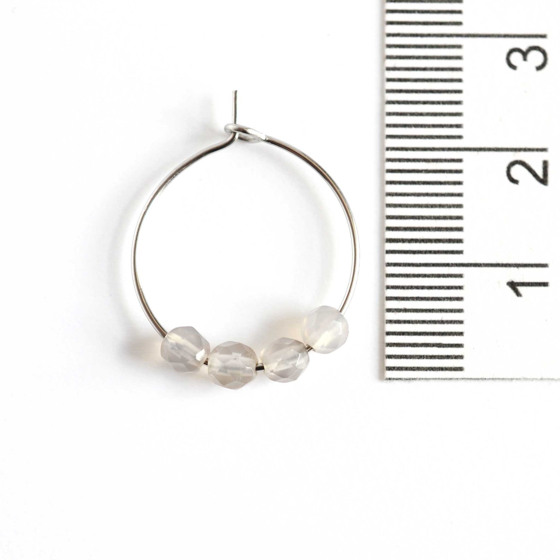 2cm diameter grey Agate gemstone hoop earrings next to ruler