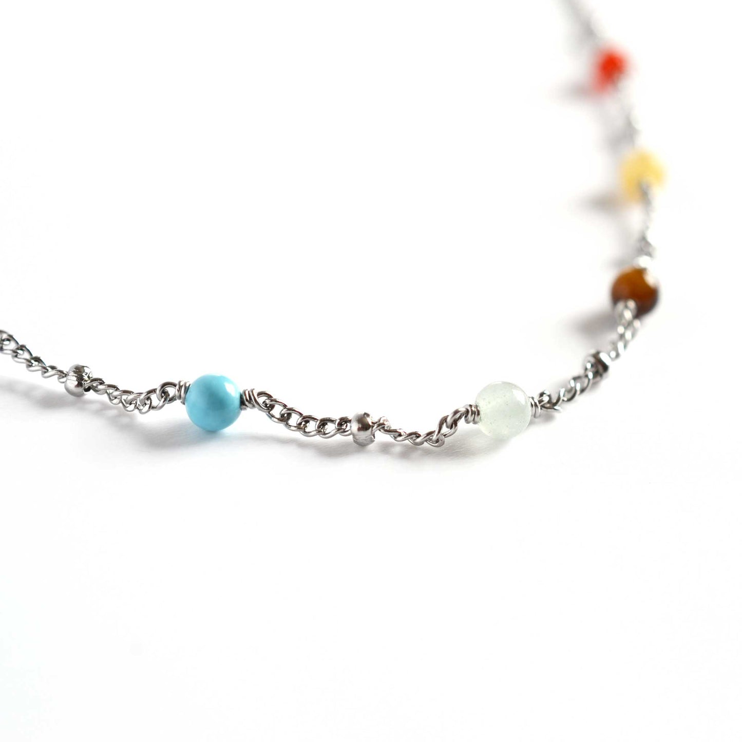 Close up of chakra necklace with seven 4mm round chakra gemstone beads
