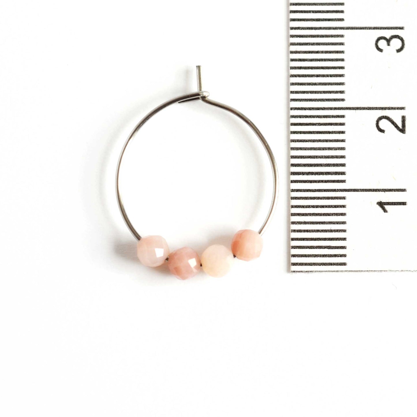 2cm diameter Pink Opal hoop earrings next to ruler
