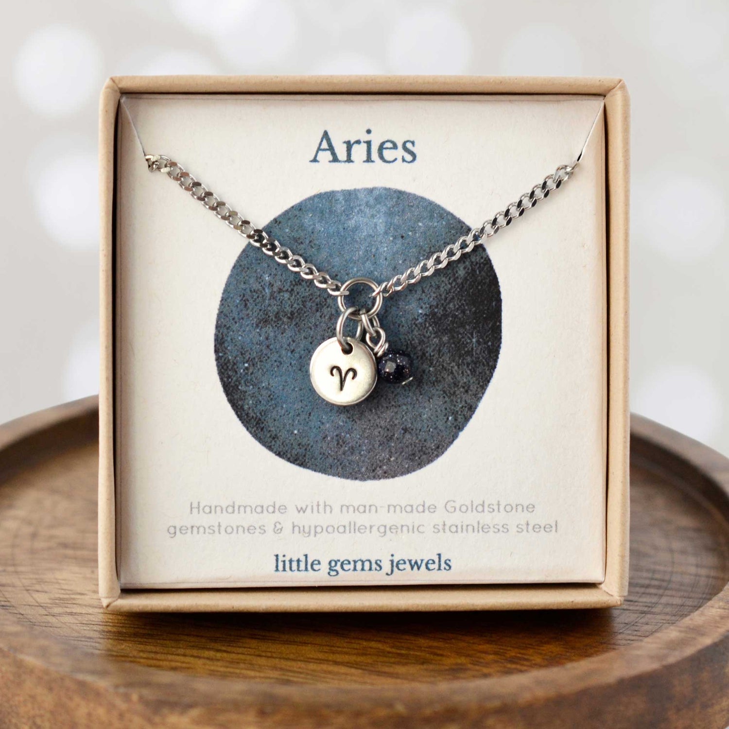 Aries Zodiac sign necklace with blue Goldstone charm in eco friendly gift box.