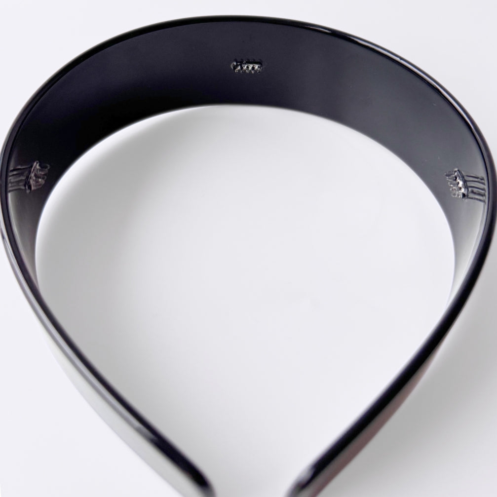 Black hairband on white background