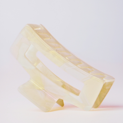 Cream hair clip on a white background