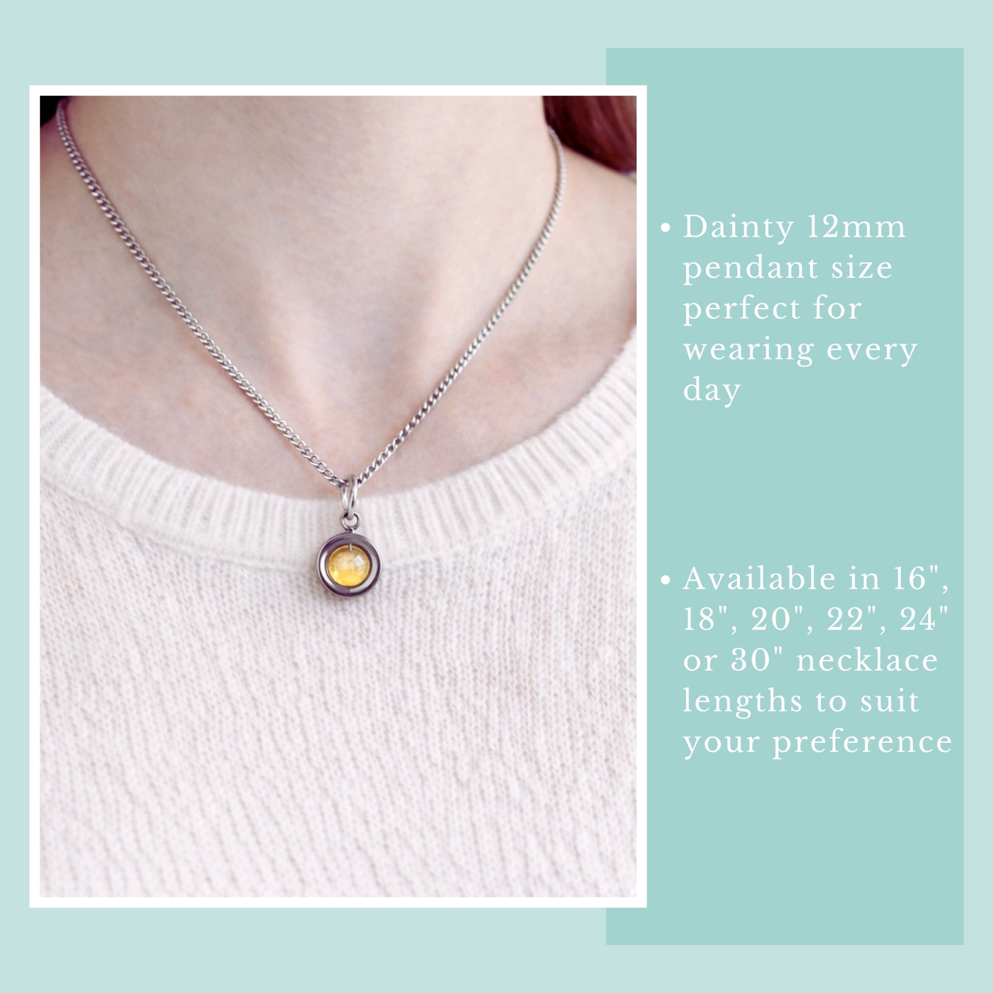 Model wearing Citrine gemstone spinner necklace and pale pink jumper.