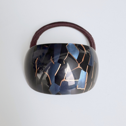 Hair tie with a unique design on a white background