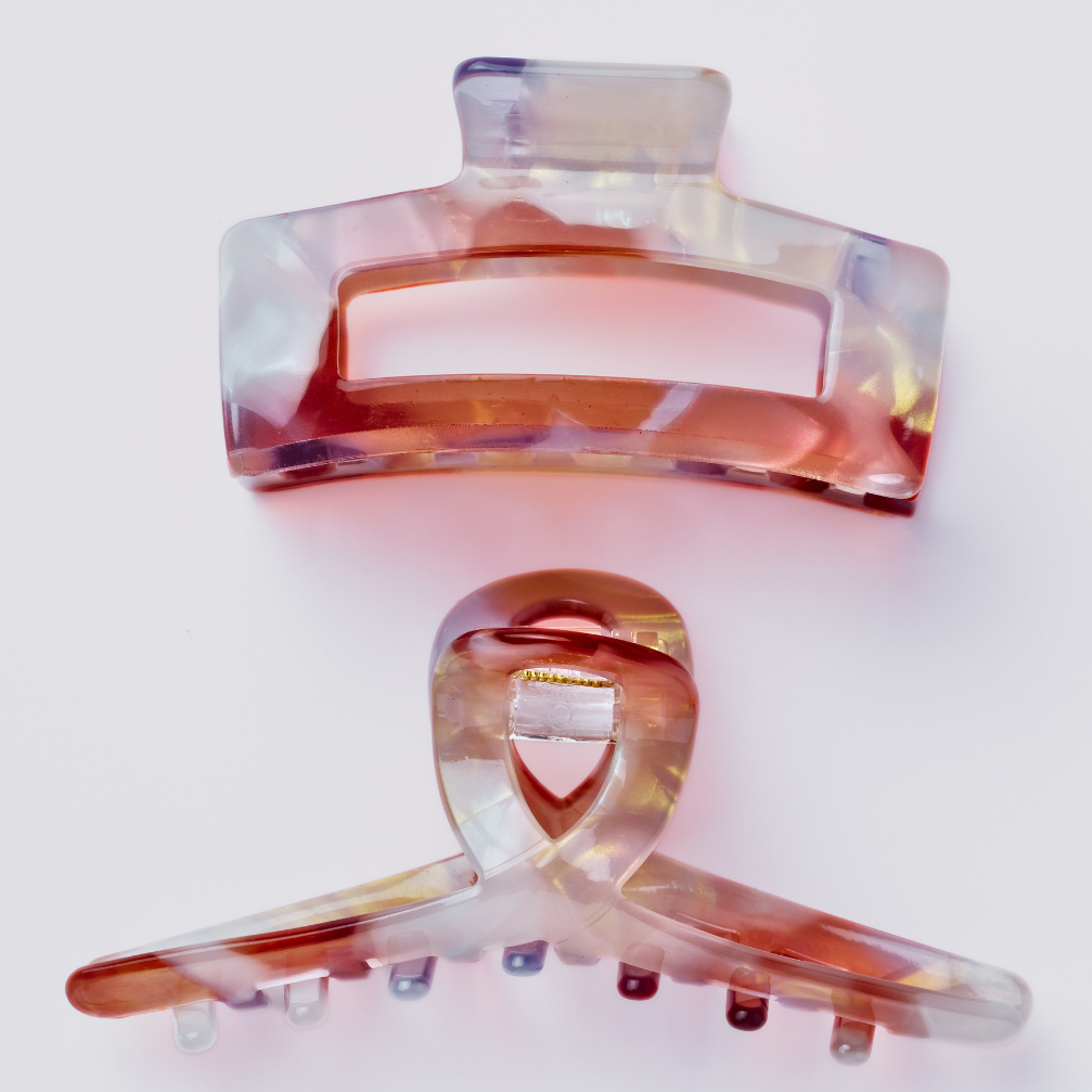 Multicolored hair clips on a white background