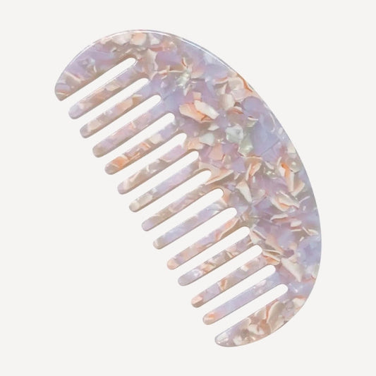 Patterned hair comb on a white background