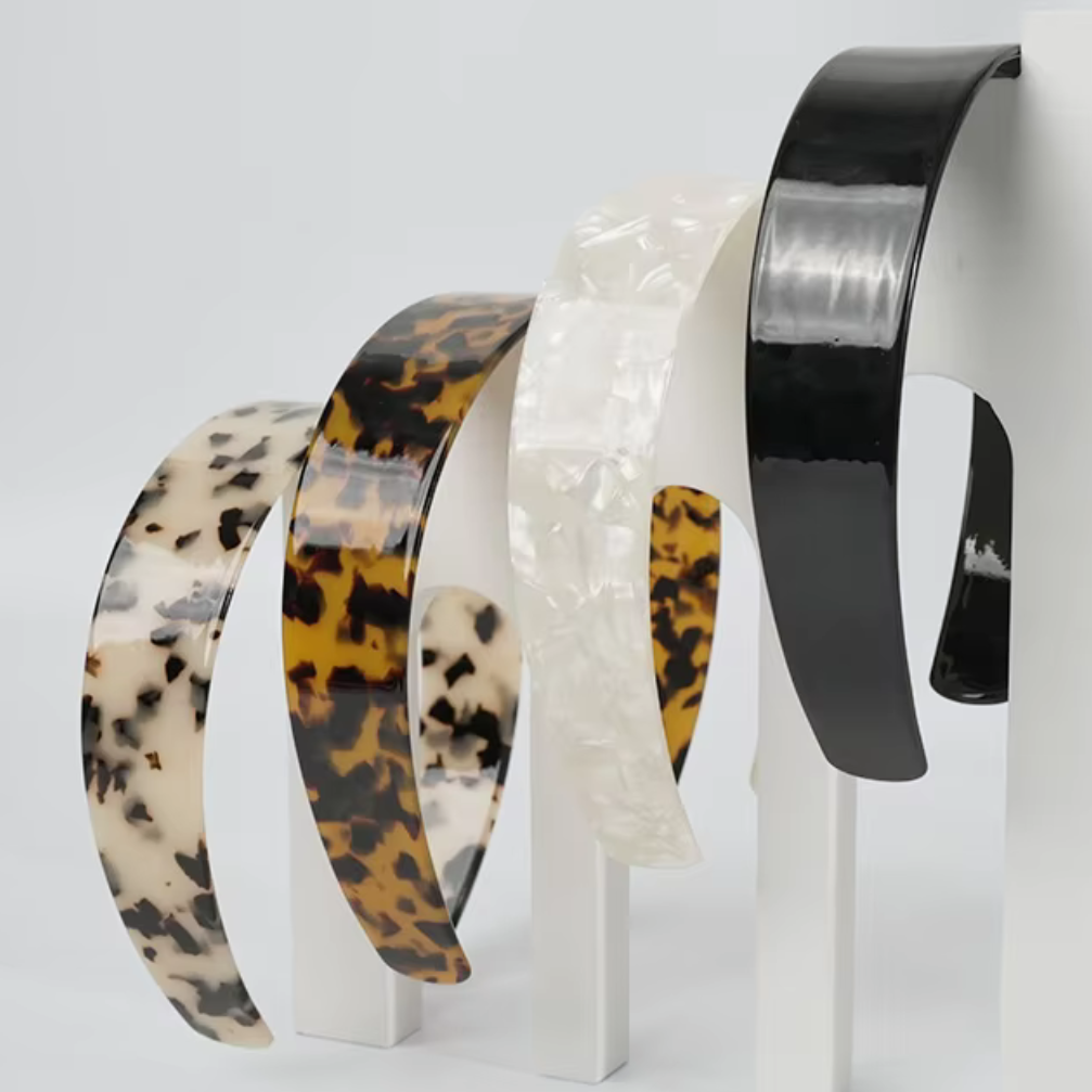 Set of three headbands with different patterns on a white background