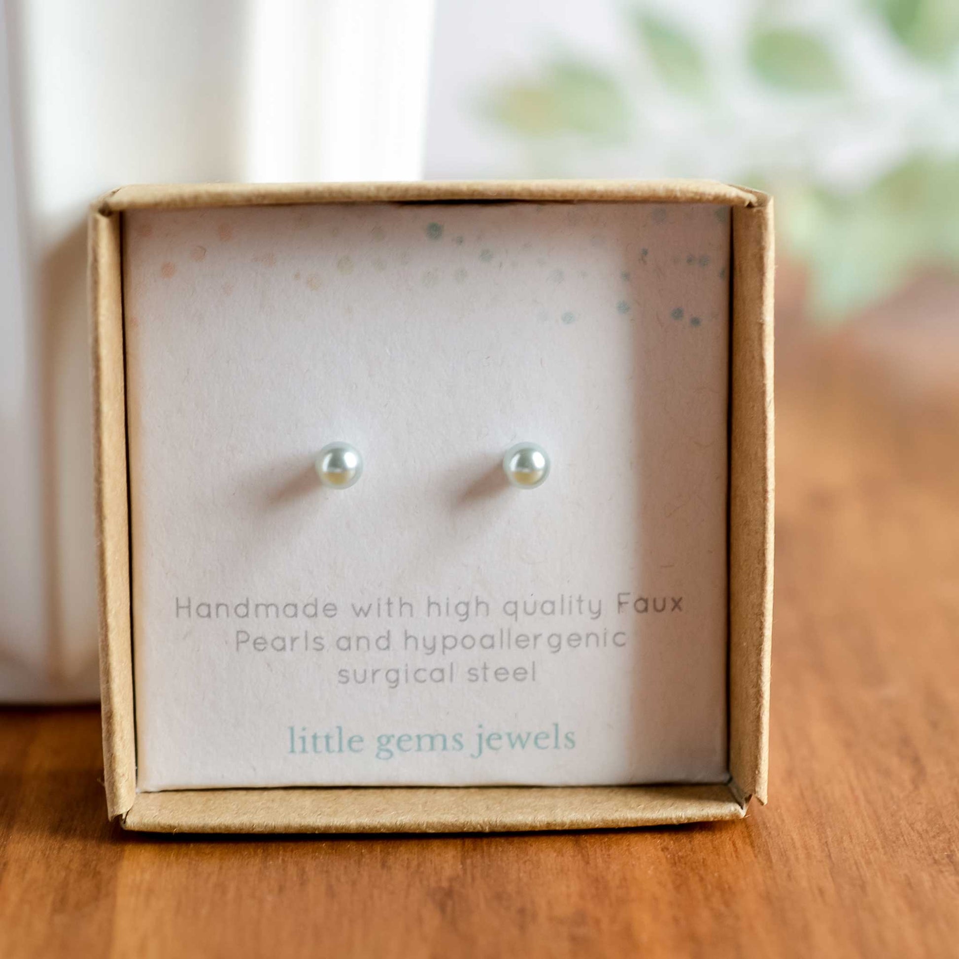 Tiny light blue faux pearl stud earrings in eco friendly gift box