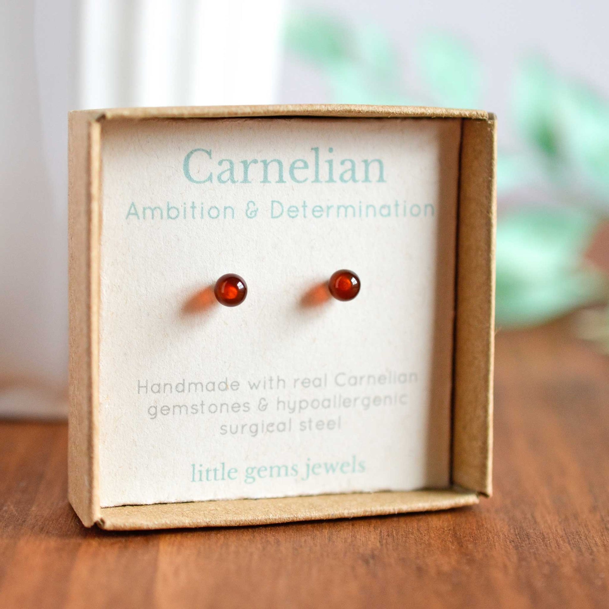 Tiny orange Carnelian stud earrings in eco friendly gift box