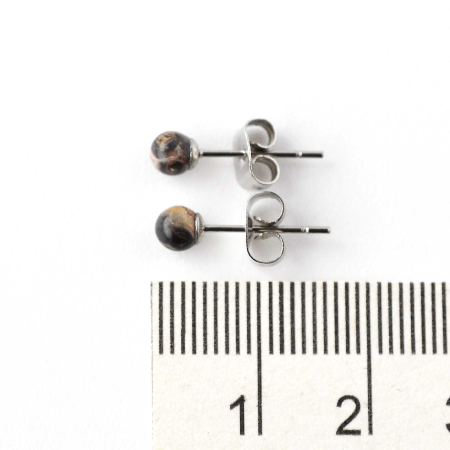 4mm Jasper gemstone ball stud earrings next to ruler