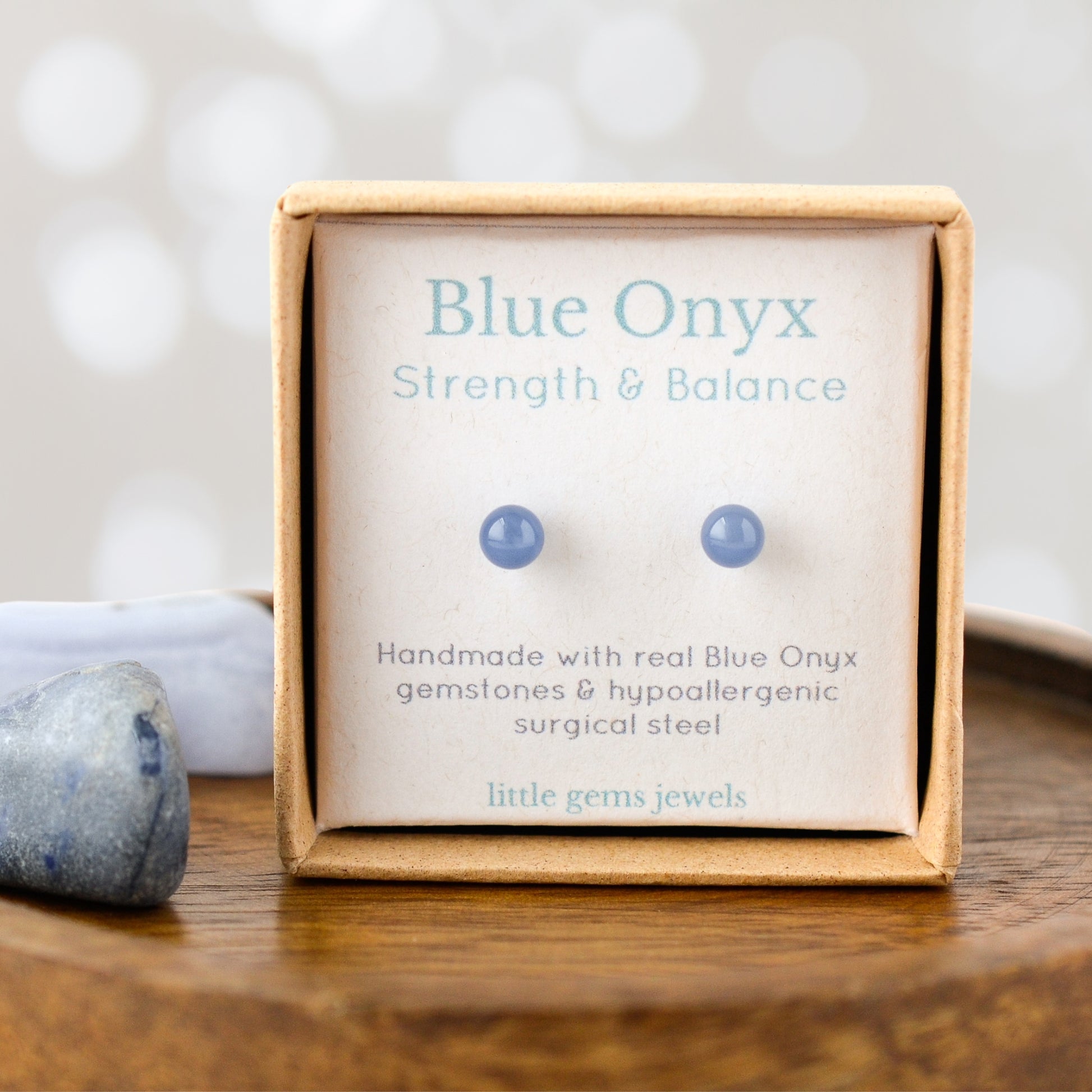 Tiny Blue Onyx gemstone studs for inner strength and balance in gift box