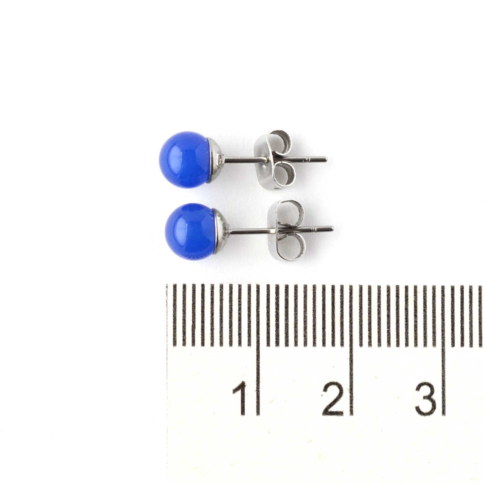 6mm Blue Onyx gemstone ball studs next to ruler