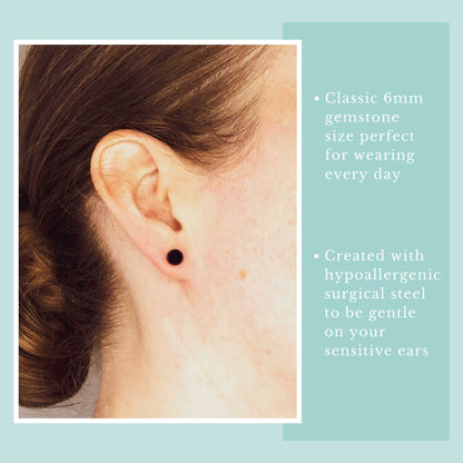 Model wearing dark blue Sodalite ball stud earring.