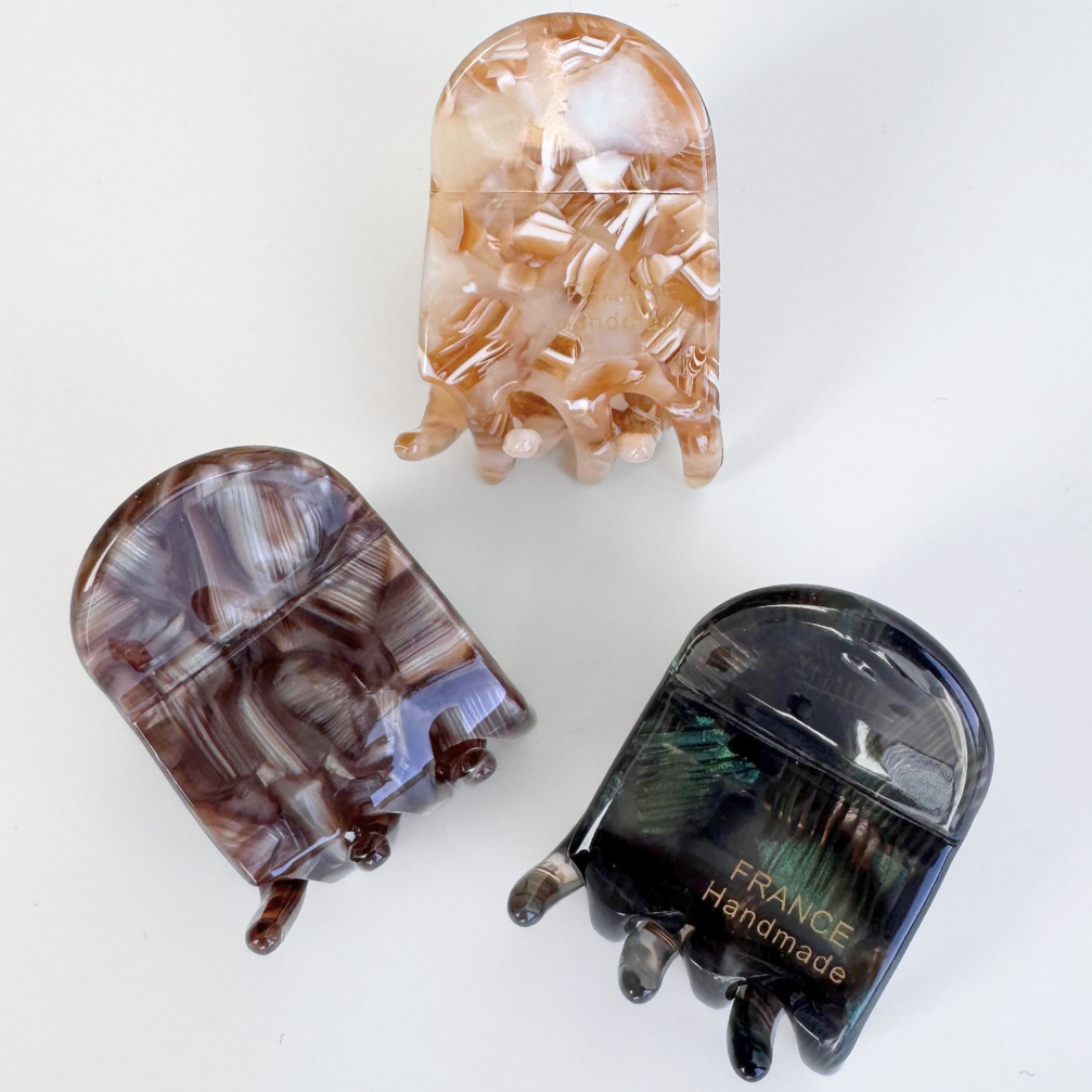 Three decorative hair clips on a white background