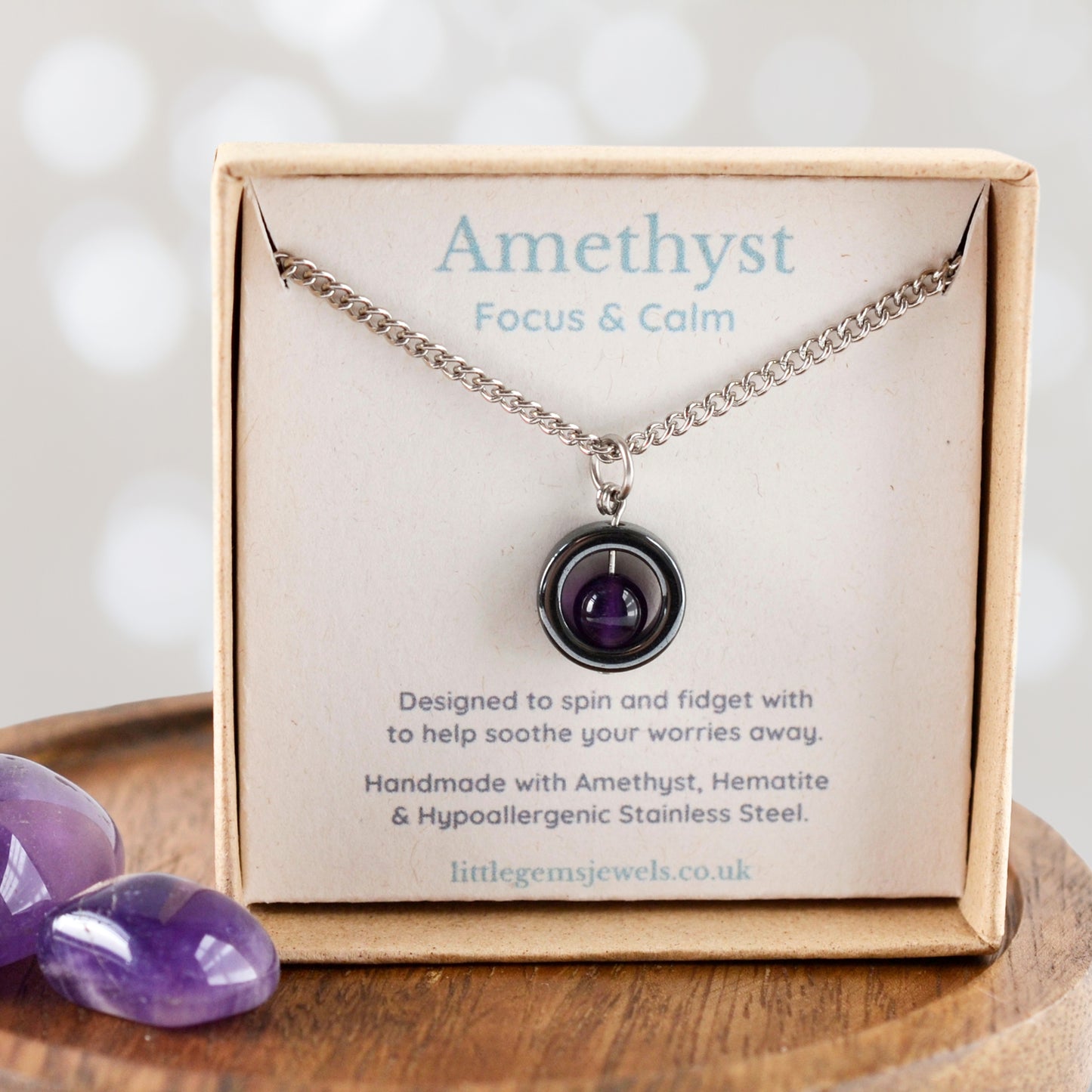 Amethyst for focus and calm gemstone spinner necklace in eco friendly gift box.