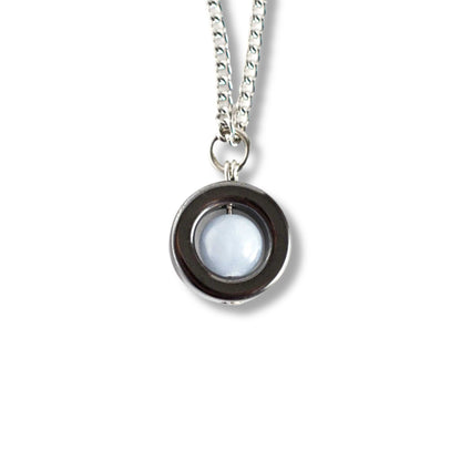 Angelite & Hematite gemstone spinner necklace on white background.