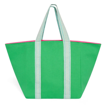 Green tote bag with white handle straps on a white background