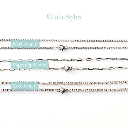 Close up of curb chain, paperclip chain and rolo chain.