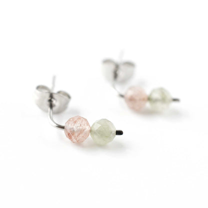 Close up of pink and green Quartz gemstones on stud earrings