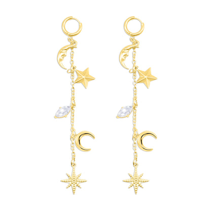 Gold earrings with star and moon charms on a white background