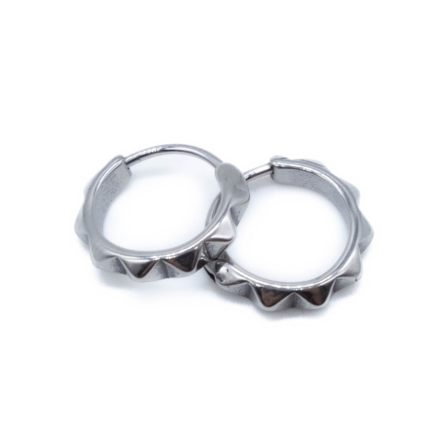 Surgical steel hoop earrings on a white background