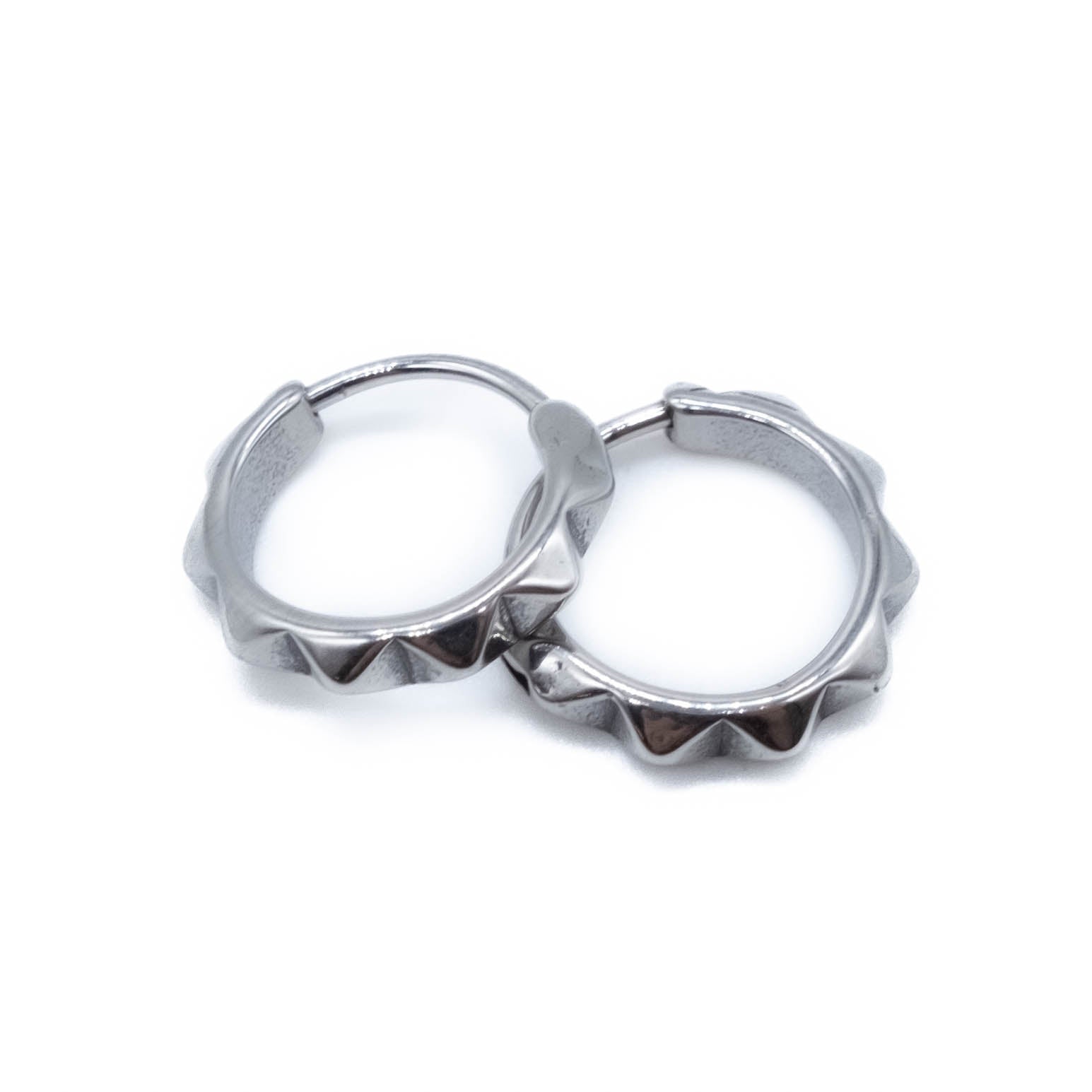 Surgical steel hoop earrings on a white background