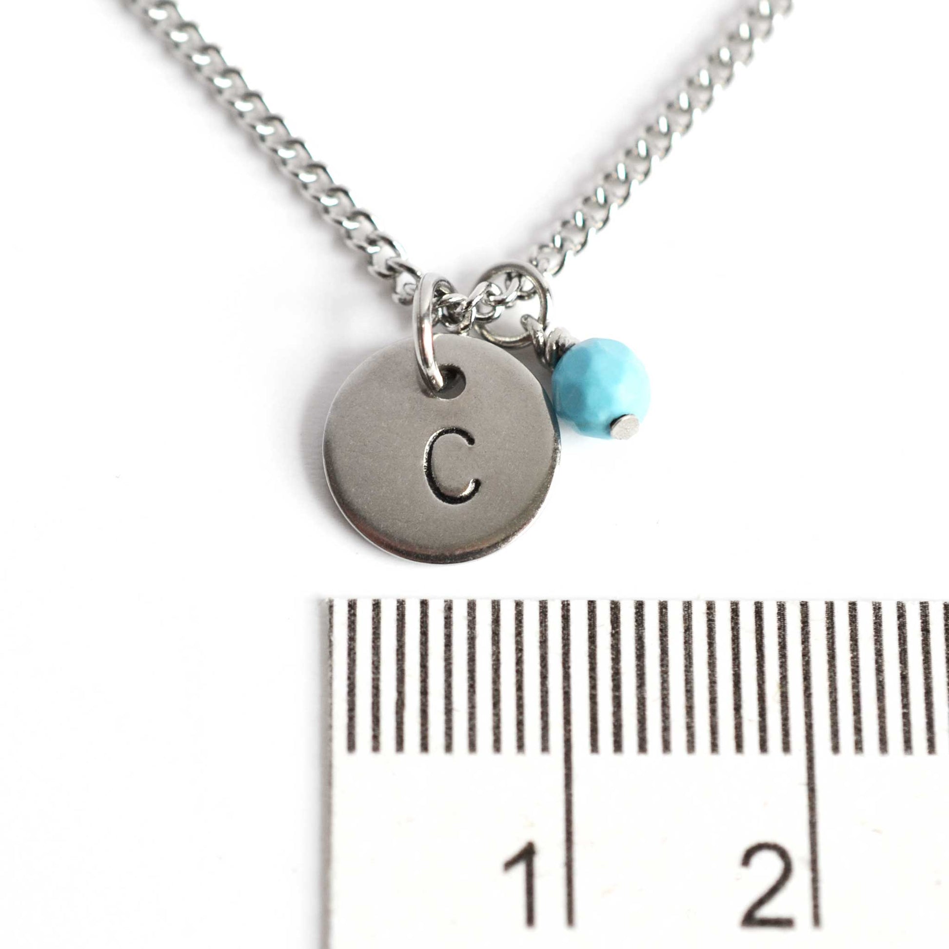 1cm diameter hand stamped initial pendant with 4mm December birthstone charm