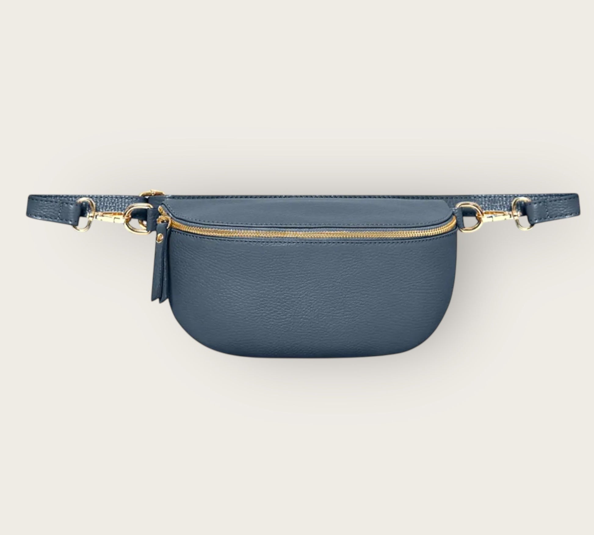 Blue waist bag with gold zipper on a light gray background