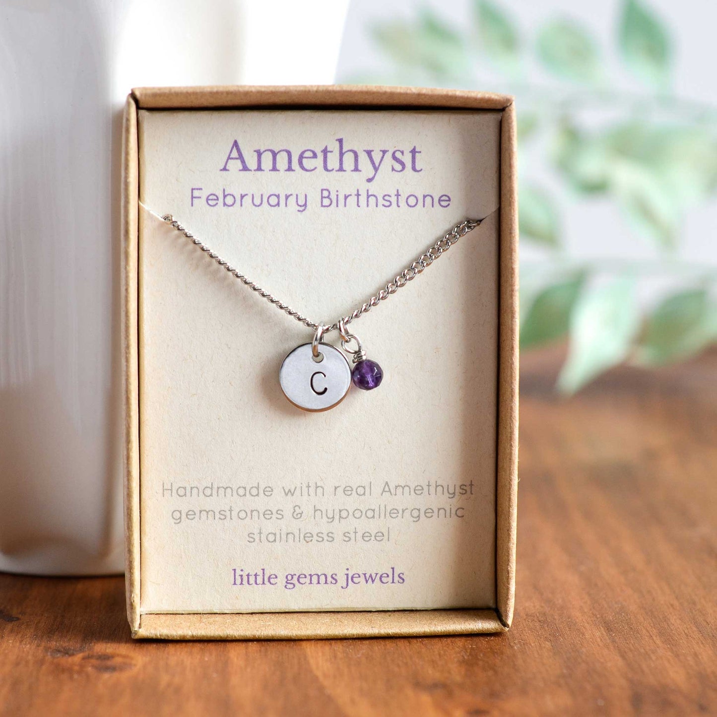 Amethyst February birthstone and initial necklace in eco friendly gift box