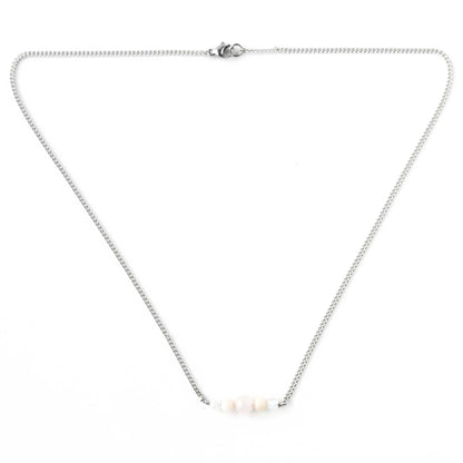 Flatlay of danty pale pink gemstone necklace on stainless steel chain with lobster clasp