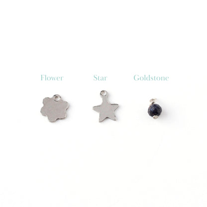 Dainty hammered flower and star charms with 4mm goldstone gemstone charm.
