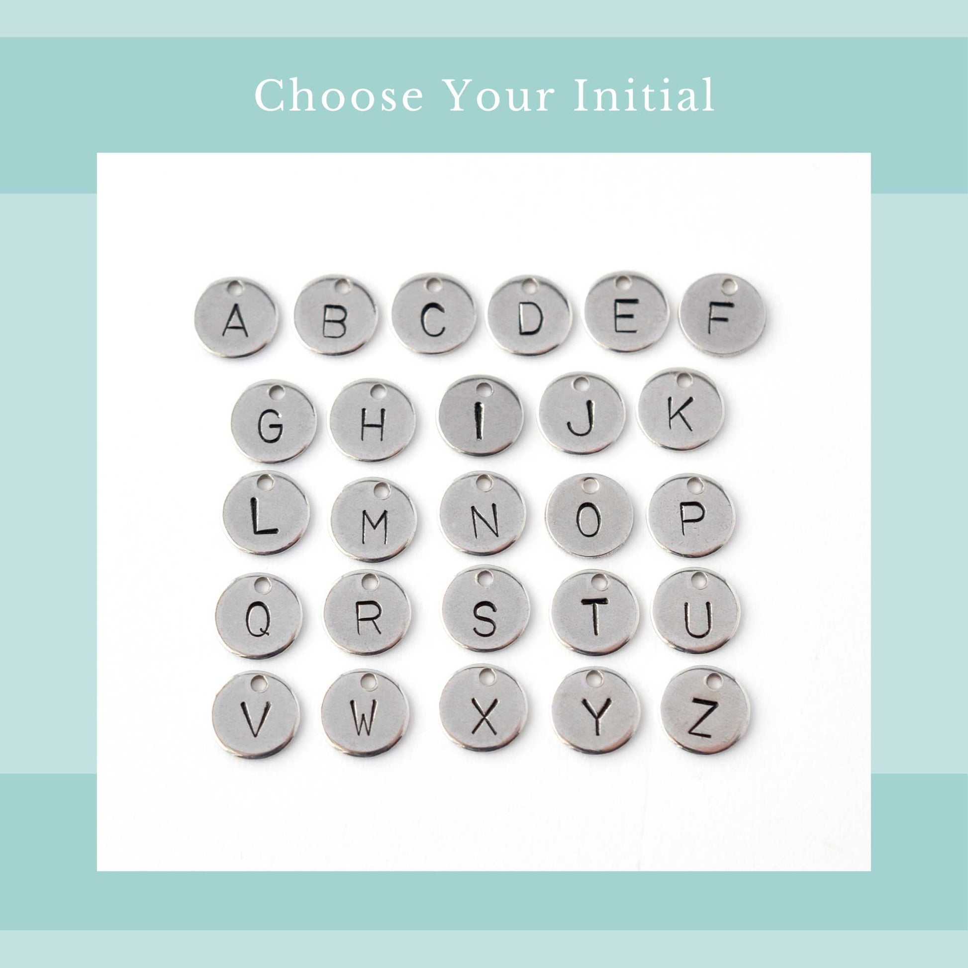 Choose your initial graphic with image of all twenty six letters of the alphabet in simple font hand stamped onto tiny disc pendants