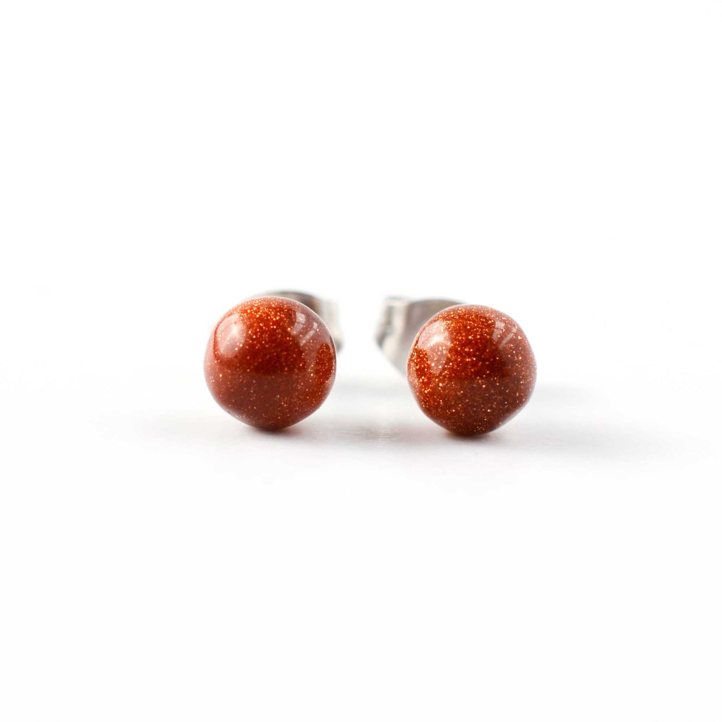 Front view of round ball Goldstone stud earrings.