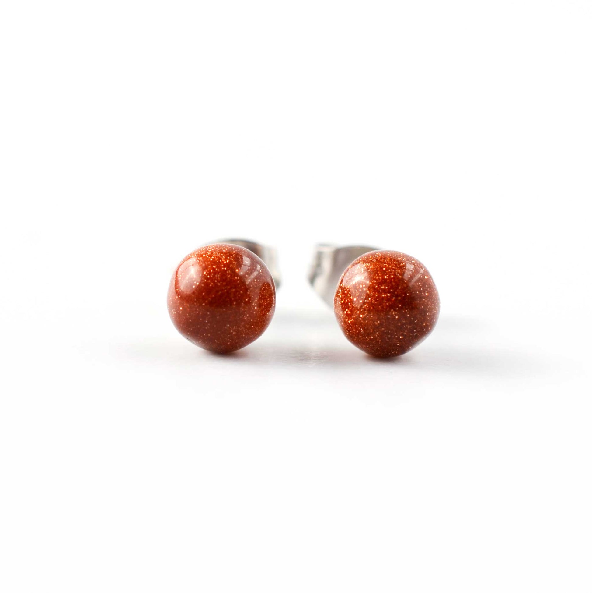 Front view of round ball Goldstone stud earrings.