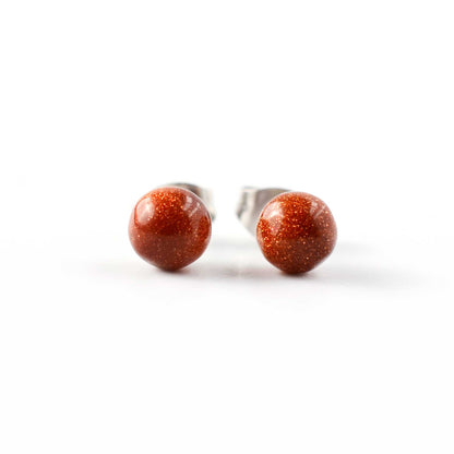 Front view of round ball Goldstone stud earrings.