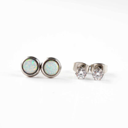 Front view of white lab opal studs and clear CZ stud earrinsg on white background.