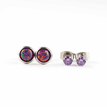 Front view of purple lab opal studs and purple CZ stud earrings on white background.
