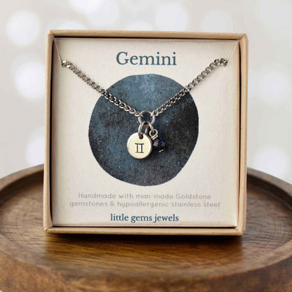 Dainty Gemini zodiac sign necklace in eco-friendly gift box on wooden coaster