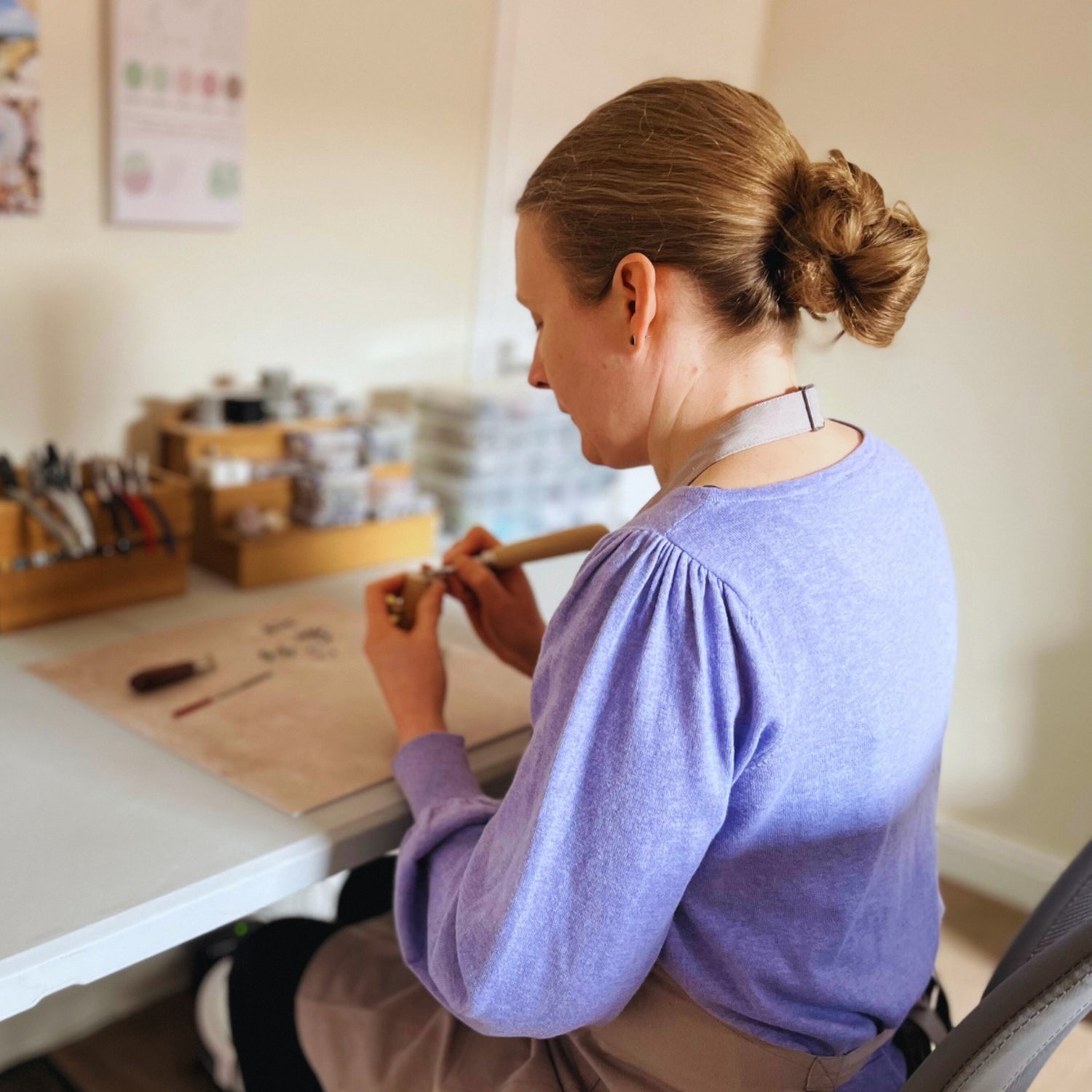 Gemma making jewellery at her work bench