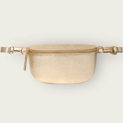 Gold waist bag on a light gray background
