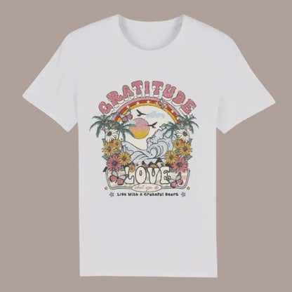 White t-shirt with a colorful graphic design on a beige background